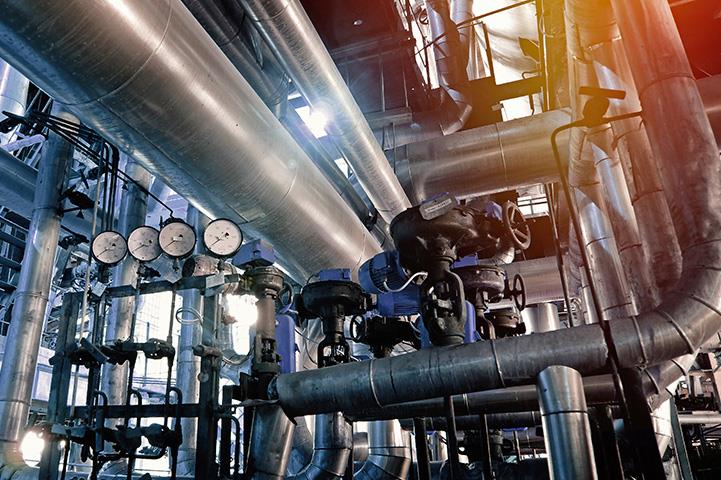 equipment pipes cables valves and meters inside an industrial power plant 