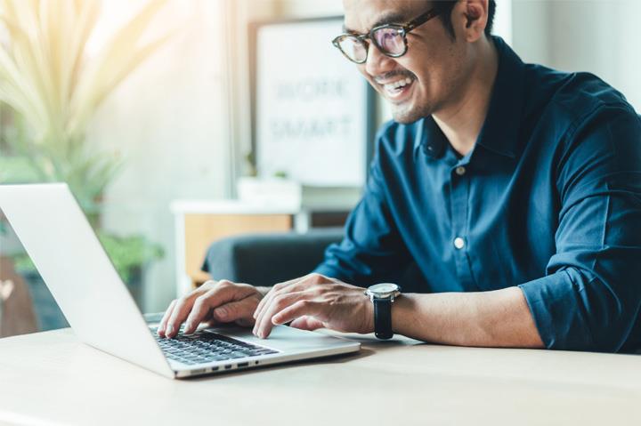Man in glasses on a laptop