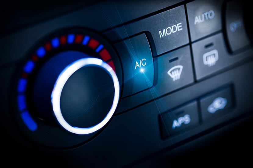 closeup of car temperature control knob and defroster