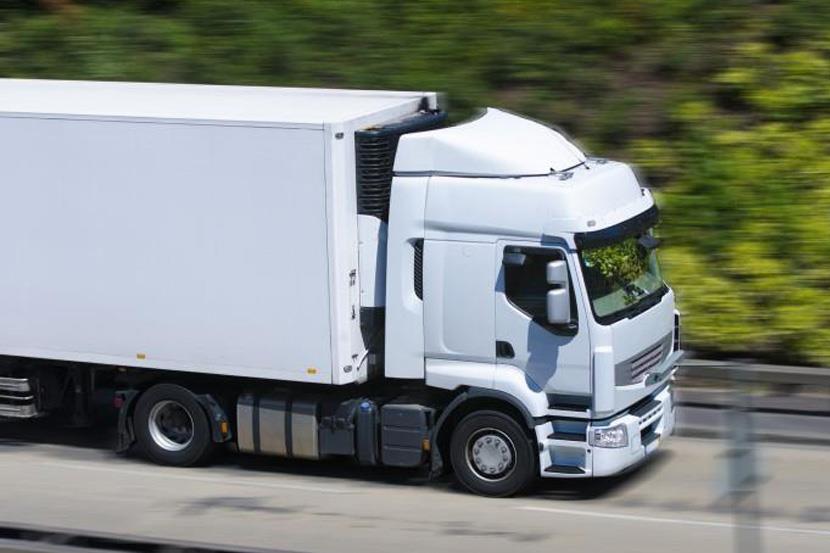 18 wheeler truck driving on a road